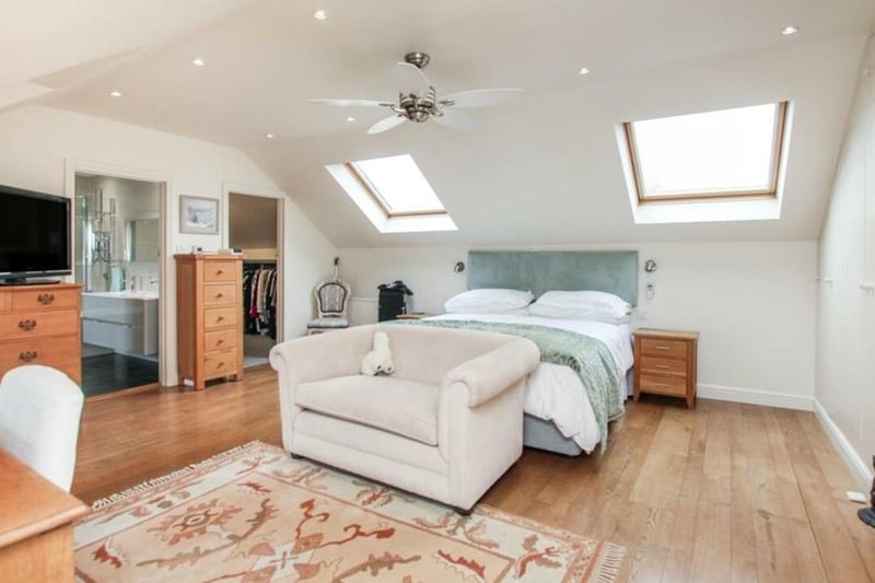 This attic bedroom is a fun space to relax and lounge in