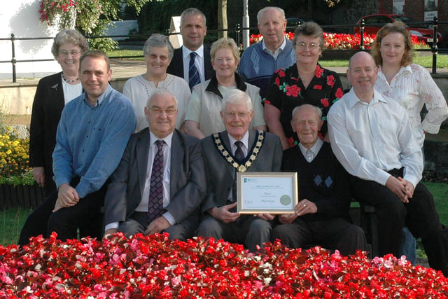Members of Scarva and District Community Association and the Chairman of Banbridge District Council, Patrick McAlinden, front centre pictured with the latest in a long line of awards won by the village in the Britain In Bloom competition in 2007