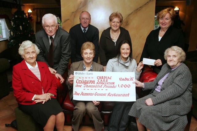Winner of the 2007 Craigavon Cardiac Care Association Draw Justine Richardson from Markethill receives her first prize of £1000 from Sharon Lavery (centre left) of the Famous Grouse who donated the prize to CCCA. Also pictured l/r are Joy Hill MBE, Bill Cummings Secretary CCCA, Rodney Wiggins Assistant Secretary CCCA, Sandra Hughes Committee CCCA Philomena Hagan Chairman CCCA and Gertude Cochrane Committee CCCA