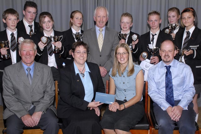 Pupils of Markethill High School who were awarded the top sports prizes following the school's sports day in 2007, which was sponsored by the Northern Bank. Also included are adults, from left, George Compston, speciaal guest, Pauline Quilty, Northern Bank, Sam Loughy, principal, Gillian Poole, head of PE and Robbie McMinn, PE teacher