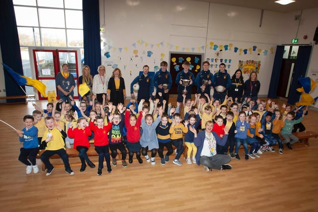Primary 2 children and staff  at Steelstown Primary Schoolcheer on their All-Ireland heroes last week. (Photo: Jim McCafferty)