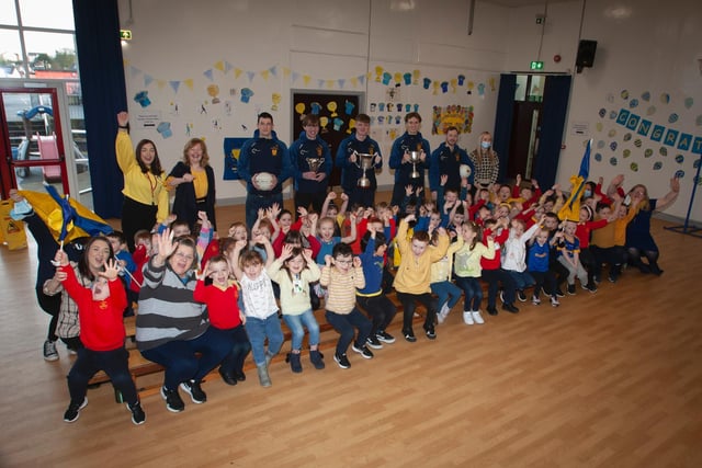 Primary 1 pupils and staff delighted to welcome members of the Brian Ogs All Ireland winning panel to Steelstown Primary School on Friday. (Photo: Jim McCafferty Photography)
