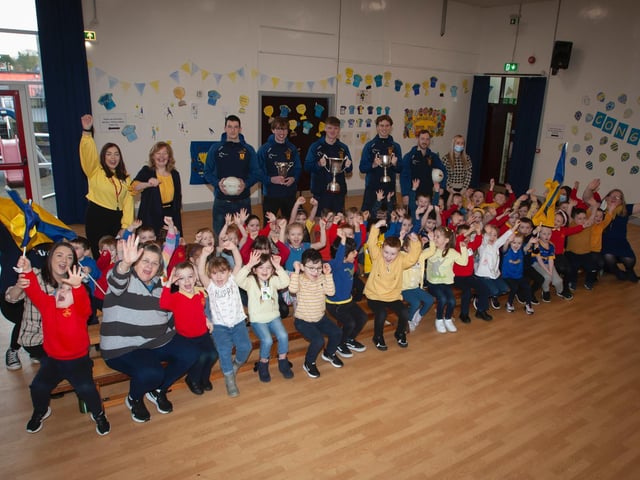 Primary 1 pupils and staff delighted to welcome members of the Brian Ogs All Ireland winning panel to Steelstown Primary School on Friday. (Photo: Jim McCafferty Photography)
