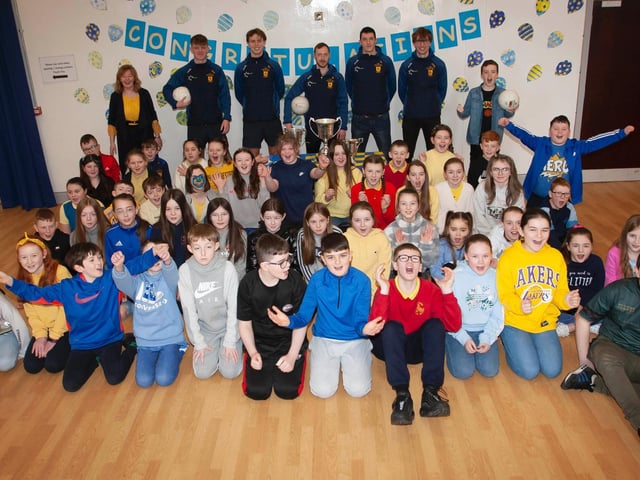 Primary 7 girls and boys delighted to welcome member of the All Ireland winning Steelstown Brian Ogs squad back to Steelstown P.S. (Photo: Jim McCafferty)