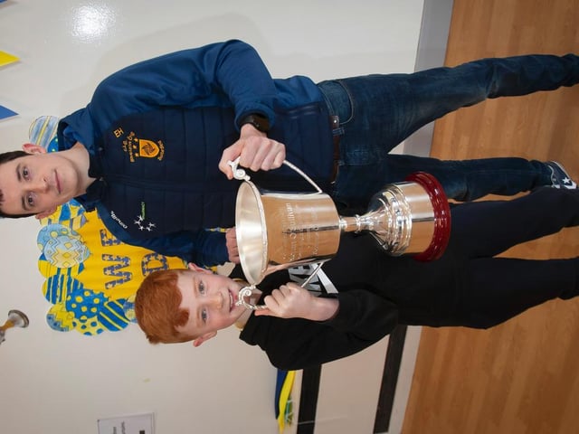 Eoghan Heraghty, Steelstown's Brian Ogs goalkeeper, pictured with his godson Eoghan Heraghty at the school last week. (Photos: Jim McCafferty Photography)