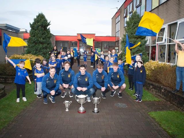 Steelstown Brian Og captain Neil Forester and team mates Donncha Gilmore, Eoghan Heraghty, Cahir O'Doherty and Oran O'Kane are given a heroes' reception as they arrive at Steelstown P.S. (Photos: Jim McCafferty)
