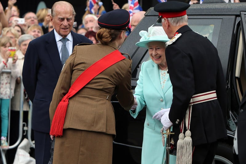 COLERAINE, NORTHERN IRELAND - JUNE 25:  Queen Elizabeth II and Prince Philip, Duke of Edinburgh arrive at the cenotaph in Coleraine during the launching of World War One commemorations, on the third and final day of the Queen's visit to Northern Ireland, on June 25, in Coleraine, Northern Ireland. (Photo by Paul Faith - WPA Pool/Getty Images)