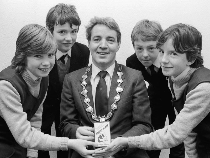 January... Mayor John Tierney is presented with a copy of the Galliagh Singers' 'GIft of Peace' charity record. From left are group members Deboragh McCauley, Paul Concannon, Michael Walsh and Brenda Phelan.