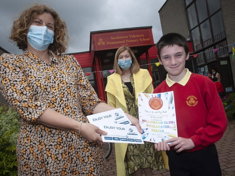 MILLIONAIRE CLUB. . . . .Matthew Oâ€TMDoherty (P7b) pictured at Steelstown Primary School this week after joining the Millionaire Club Accelerated Reading. Matthew has now reached 2,656,111 and still climbing. Presenting him with his gift and certificate is Mrs. Victoria Oâ€TMNeill, Literacy Co-Ordinator and centre back, Mrs. Siobhan Gillen, Principal. (Photos: Jim McCafferty Photography)