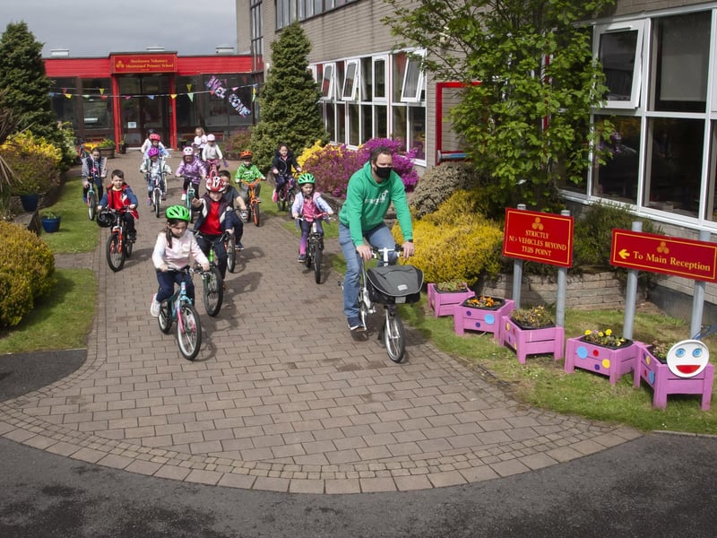 Richard Farrow leads Steelstown pupils for their †̃Cycle Skillsâ€TM session at the school last week.