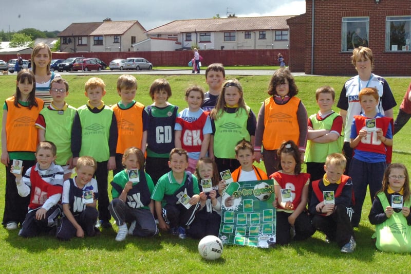 Children from Ebrington Primary School take part in the IFA Green Card programme which aims to build confidence and self esteem thorugh sport. Included are teacher Joanne Donaldson, left, and Patricia, IFA DENI coach. (2205PG11)