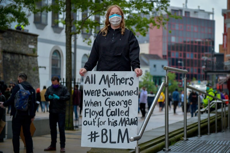 Woman with a poster at the Justice for George Floyd rally held in Guildhall Square on Saturday afternoon last. DER2320GS – 038