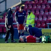 Grant Leadbitter receives treatment at Gresty Road