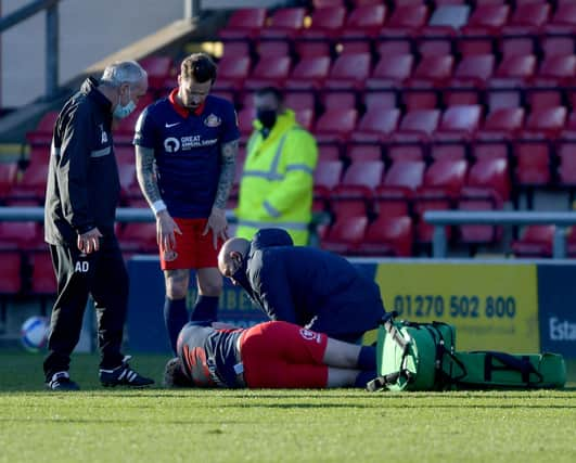 Grant Leadbitter receives treatment at Gresty Road