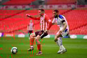Aiden McGeady of Sunderland battles for possession with Liam Feeney of Tranmere Rovers during the Papa John's Trophy final match.