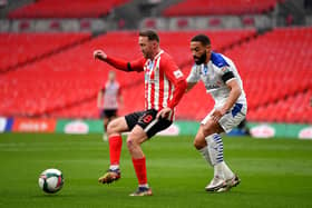 Aiden McGeady of Sunderland battles for possession with Liam Feeney of Tranmere Rovers during the Papa John's Trophy final match.