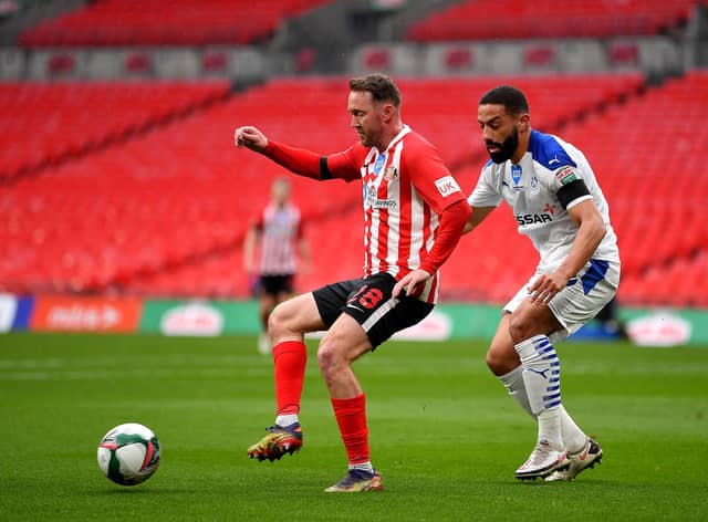 Aiden McGeady of Sunderland battles for possession with Liam Feeney of Tranmere Rovers during the Papa John's Trophy final match.