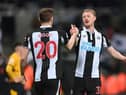 Newcastle player Sean Longstaff congratulates goal scorer Chris Wood after the Premier League match between Newcastle United and Wolverhampton Wanderers at St. James Park on April 08, 2022 in Newcastle upon Tyne, England. (Photo by Stu Forster/Getty Images)