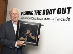 Robert Olley holding his original oil painting entitled ‘Fag Break’