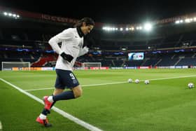 PARIS, FRANCE - MARCH 11: (FREE FOR EDITORIAL USE) In this handout image provided by UEFA, Edinson Cavani of Paris Saint-Germain runs out to warm up prior to the UEFA Champions League round of 16 second leg match between Paris Saint-Germain and Borussia Dortmund at Parc des Princes on March 11, 2020 in Paris, France. The match is played behind closed doors as a precaution against the spread of COVID-19 (Coronavirus).  (Photo by UEFA - Handout/UEFA via Getty Images)