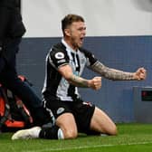 Kieran Trippier of Newcastle United celebrates after scoring their sides third goal during the Premier League match between Newcastle United and Everton at St. James Park on February 08, 2022 in Newcastle upon Tyne, England. (Photo by Stu Forster/Getty Images)