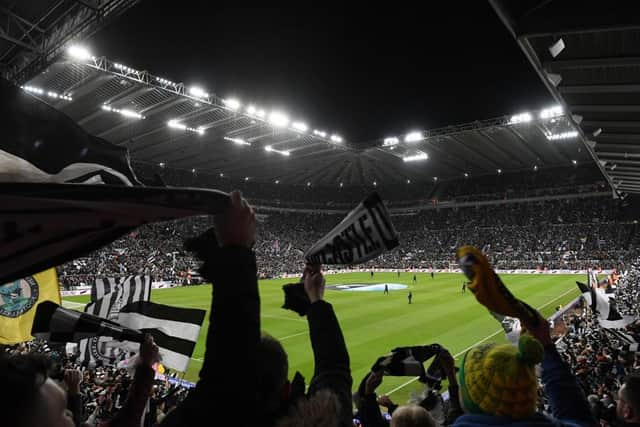 Fans enjoy the pre-match atmosphere. by Stu Forster/Getty Images)