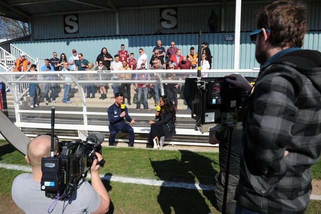 Fans look on as South Shields boss Kevin Phillips talks to Alex Scott