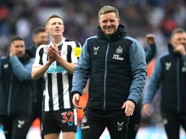 Newcastle United head coach Eddie Howe and players celebrate after the final whistle.