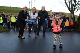 South Tyneside Council Leader Cllr Tracey Dixon and South Shields Football Club's Geoff Thompson, with North Marine Park Junior Park Run director Sally Foreman, and her daughter Abigail.
