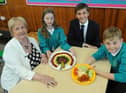 Leon Hardie and Ruby Dougherty, pupils at Bedeburn Primary School in Jarrow, with Councillors Margaret Meling and Adam Ellison.