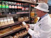 Environmental Health Officer David Jarvis checks allergen information and signage at MI Dicksons.