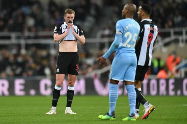 Sean Longstaff of Newcastle United is seen dejected during the Premier League match between Newcastle United and Manchester City at St. James Park on December 19, 2021 in Newcastle upon Tyne, England. (Photo by Stu Forster/Getty Images)