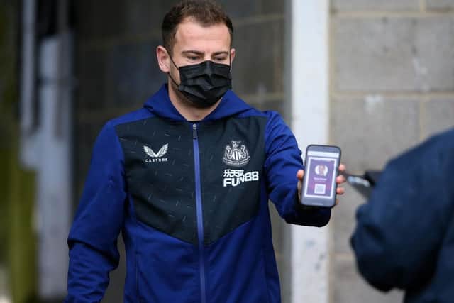 Ryan Fraser of Newcastle United has his Covid-19 pass scanned as he arrives at the stadium prior to the Premier League match between Newcastle United and Manchester City at St. James Park on December 19, 2021 in Newcastle upon Tyne, England. (Photo by Alex Livesey/Getty Images)