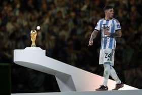 LUSAIL CITY, QATAR - DECEMBER 18: Enzo Fernandez of Argentina poses with the FIFA Young Player award trophy at the award ceremony following the FIFA World Cup Qatar 2022 Final match between Argentina and France at Lusail Stadium on December 18, 2022 in Lusail City, Qatar. (Photo by Lars Baron/Getty Images)