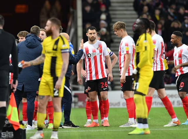 Players leaving the pitch after play was stopped at the Stadium of Light to provide medical treatment to supporter Michael Waggott, who the club have announced has now sadly passed away.