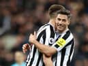 Sean Longstaff and Fabian Schaer of Newcastle United celebrate following the Premier League match between Newcastle United and Wolverhampton Wanderers at St. James Park on March 12, 2023 in Newcastle upon Tyne, England. (Photo by Naomi Baker/Getty Images)