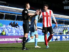 Kyle Lafferty complains to the officials after Max Power's goal was ruled out.