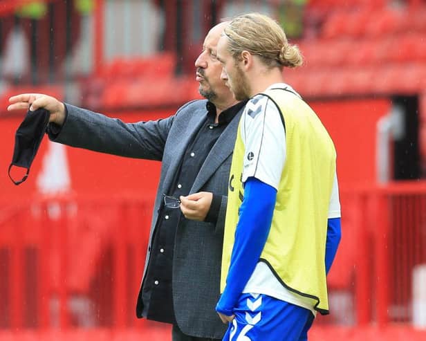 Everton midfielder Tom Davies pictured alongside Rafa Benitez. (Photo by LINDSEY PARNABY/AFP via Getty Images)