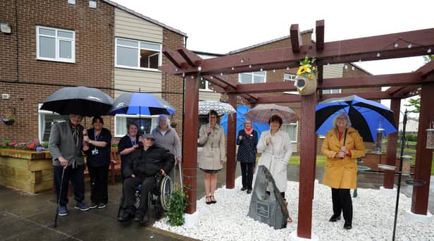 South Tyneside Council leader Cllr Tracey Dixon, deputy leader Cllr Joan Atkinson, Cllr Anne Hetherington, and Vicki Pattison, at Clare Blake's memorial garden, Clasper Court, South Shields.