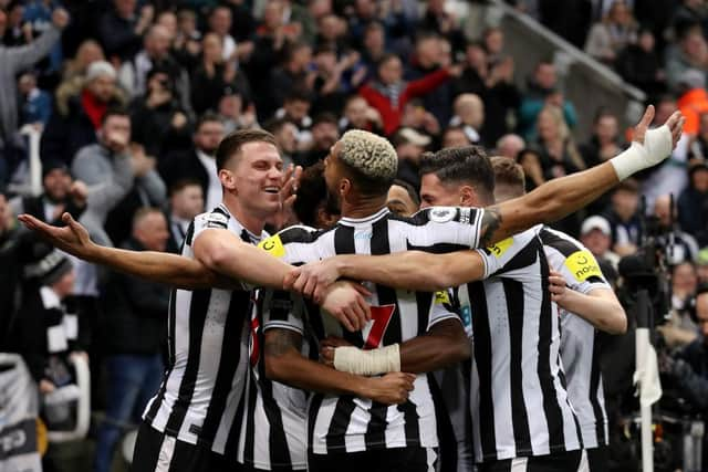 Sven Botman, left, celebrates a goal from Joe Willock, not pictured, which was later disallowed.