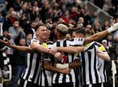 Sven Botman, left, celebrates a goal from Joe Willock, not pictured, which was later disallowed.