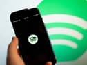 This illustration photo shows the Spotify logo 
(Photo by Stefani Reynolds / AFP) (Photo by STEFANI REYNOLDS/AFP via Getty Images)