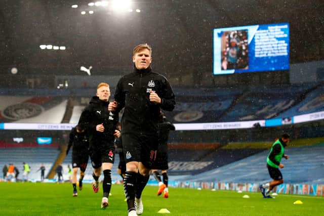 Newcastle United's Scottish midfielder Matt Ritchie warms up for the English Premier League football match between Manchester City and Newcastle United at the Etihad Stadium in Manchester, north west England, on December 26, 2020.