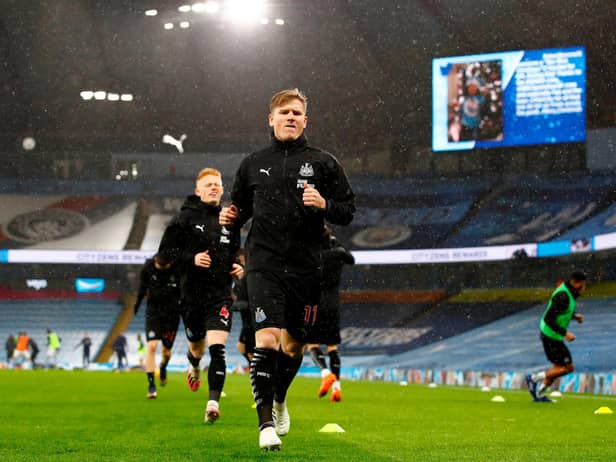 Newcastle United's Scottish midfielder Matt Ritchie warms up for the English Premier League football match between Manchester City and Newcastle United at the Etihad Stadium in Manchester, north west England, on December 26, 2020.