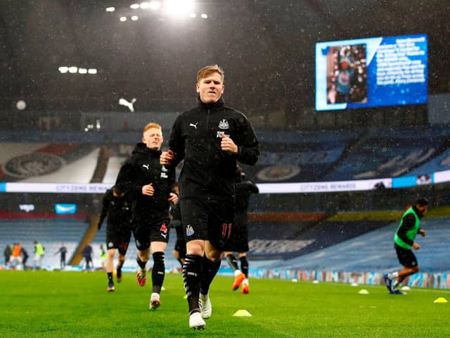 Newcastle United's Scottish midfielder Matt Ritchie warms up for the English Premier League football match between Manchester City and Newcastle United at the Etihad Stadium in Manchester, north west England, on December 26, 2020.