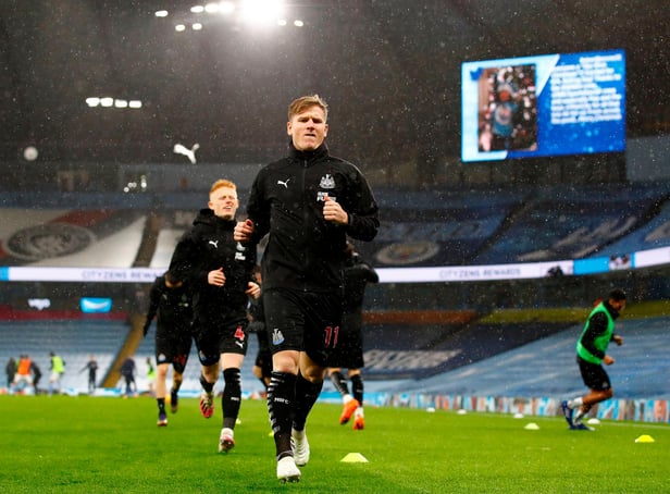 Newcastle United's Scottish midfielder Matt Ritchie warms up for the English Premier League football match between Manchester City and Newcastle United at the Etihad Stadium in Manchester, north west England, on December 26, 2020.