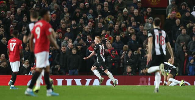 MANCHESTER, ENGLAND - DECEMBER 26: Matty Longstaff of Newcastle United celebrates scoring their first goal during the Premier League match between Manchester United and Newcastle United at Old Trafford on December 26, 2019 in Manchester, United Kingdom. (Photo by Tom Purslow/Manchester United via Getty Images)