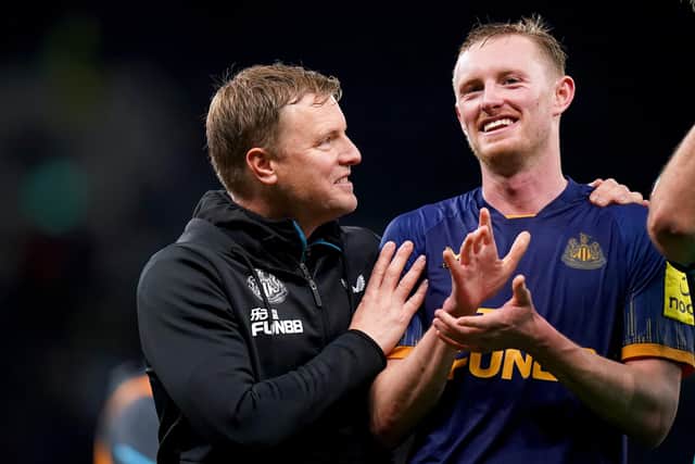 Newcastle United head coach Eddie Howe celebrates this month's win over Tottenham Hotspur with Sean Longstaff.