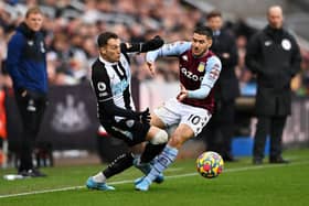 Javier Manquillo of Newcastle United collides with Emiliano Buendia of Aston Villa during the Premier League match between Newcastle United and Aston Villa at St. James Park on February 13, 2022 in Newcastle upon Tyne, England. (Photo by Stu Forster/Getty Images)