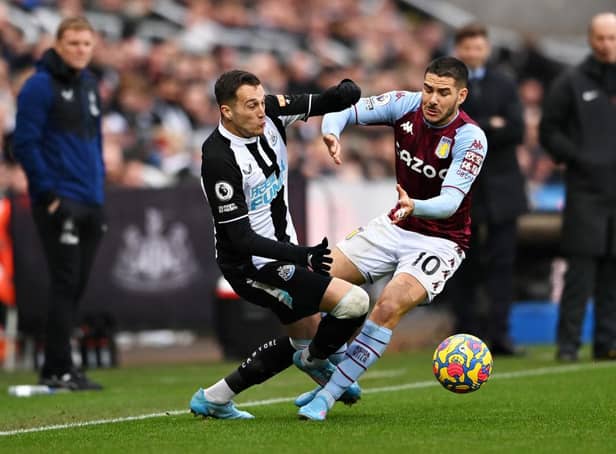 Javier Manquillo of Newcastle United collides with Emiliano Buendia of Aston Villa during the Premier League match between Newcastle United and Aston Villa at St. James Park on February 13, 2022 in Newcastle upon Tyne, England. (Photo by Stu Forster/Getty Images)